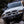Load image into Gallery viewer, Vehicle on a bush road at night lit by Lightforce Genesis driving lights
